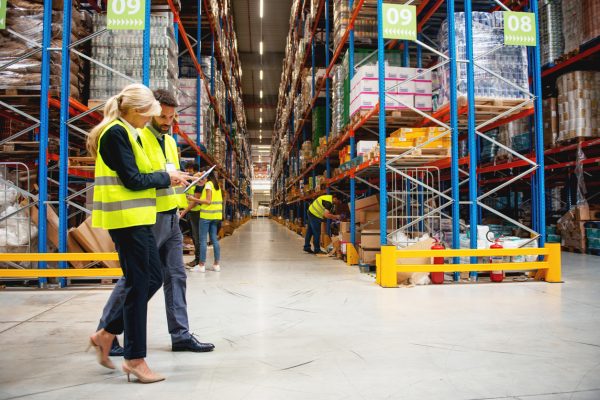 Managers in Warehouse discuss about business